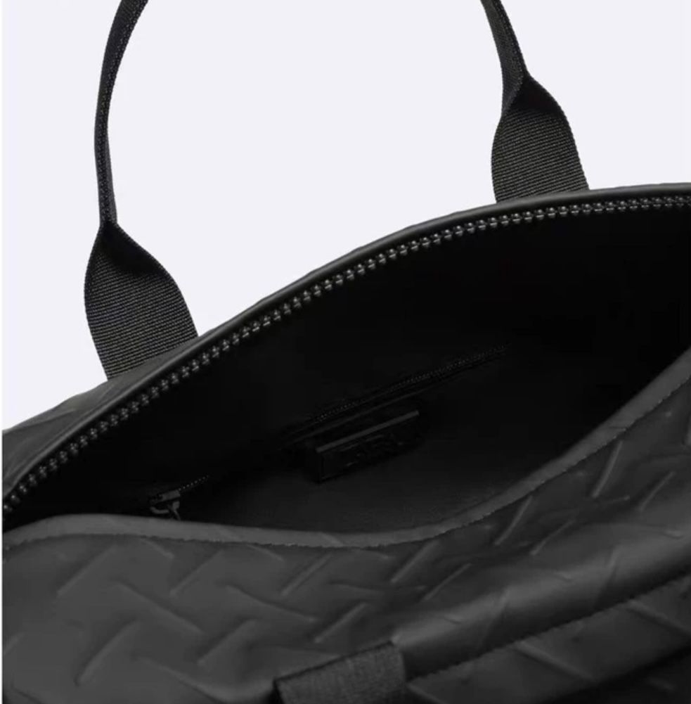 LS Fashion black weekender bag with quilted texture and top zipper opening showing interior zipper pocket
