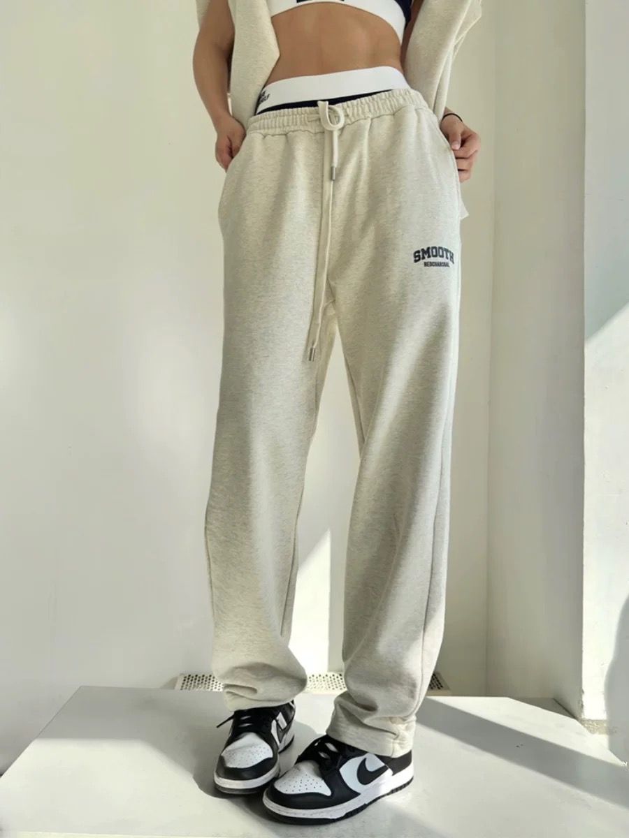 Casual light beige women's jogger set pants with drawstring waist and sneakers